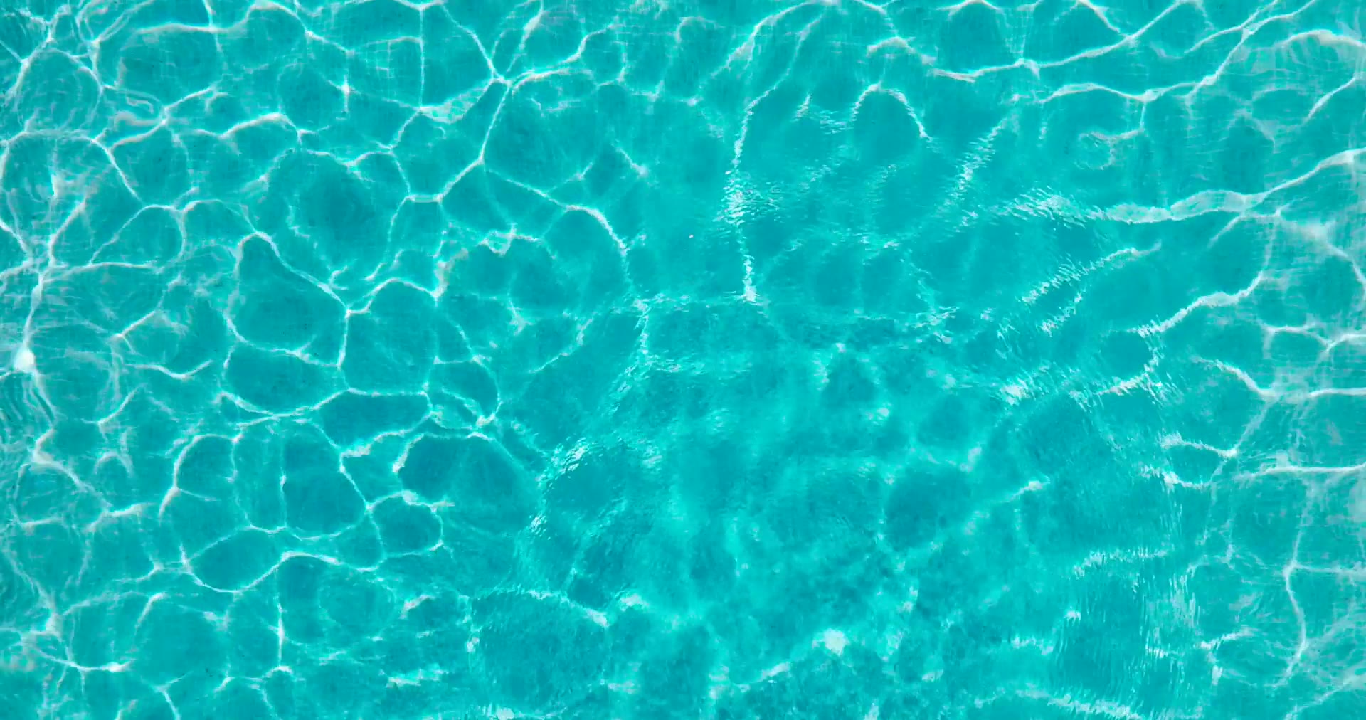 Clear fiberglass pool water with a smooth gelcoat finish